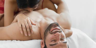 woman above man in bed