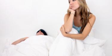 Bored couple in bed