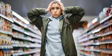 woman feels stressed at grocery store