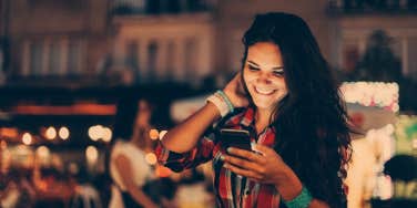 woman out with her friends texting casually 