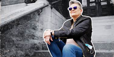Author sitting on the stairs outside