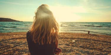 woman looking at the ocean