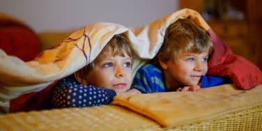 two boys watching tv