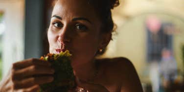 woman eating wrap