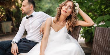 bride and groom looking away from each other