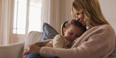 mother holding daughter