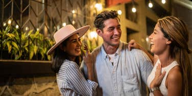 Man enjoying date with two woman 