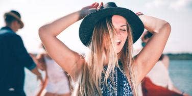 woman in hat having fun