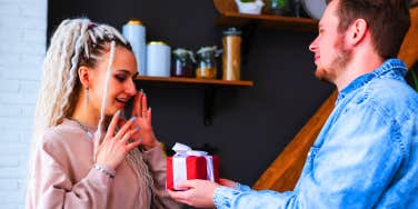 man giving girlfriend a present