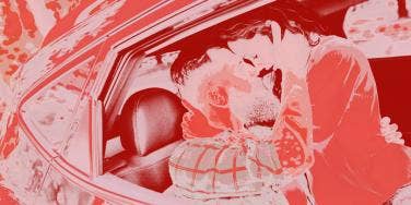 couple kissing in car