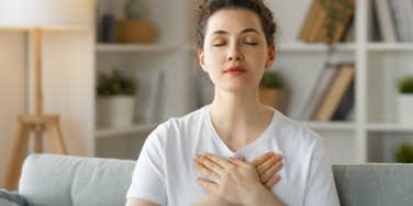 woman holding her heart