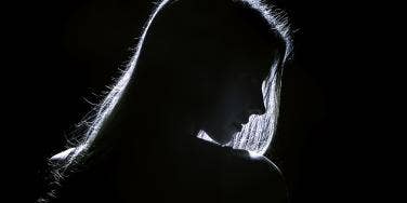 woman in profile shot in black and white