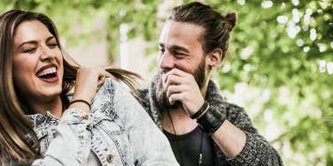 woman and man laughing with each other