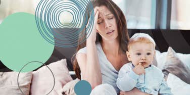 Stressed out mom holding baby