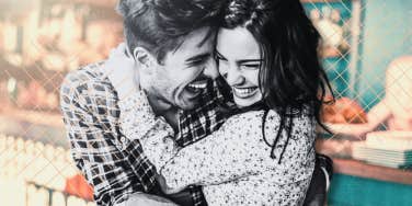 a man and woman in a happy embrace