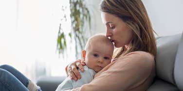 mother holding baby