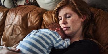 woman with baby on chest