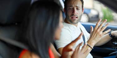 man yelling at woman in car