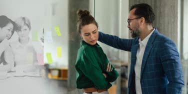 Woman reporting workplace harassment, in a uncomfortable position