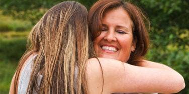 mom hugging daughter