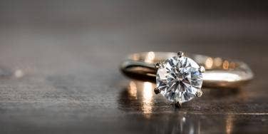 engagement ring sitting on table