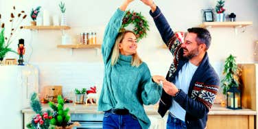 couple dancing in their kitchen to romantic Christmas love songs