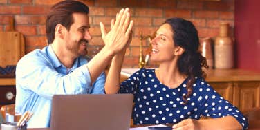 couple high fiving after scheduling sex