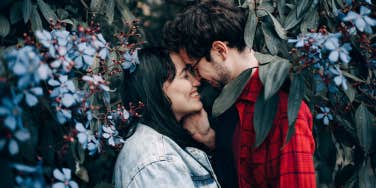 couple about to kiss in trees