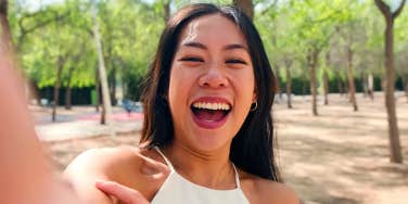 smiling girl taking selfie