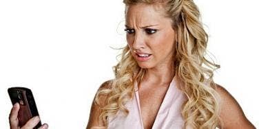 woman confused at cell phone