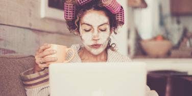 woman working at home in curlers