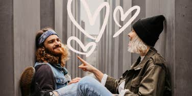 Couple sitting in a alley