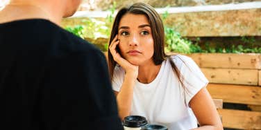 Bored woman at table