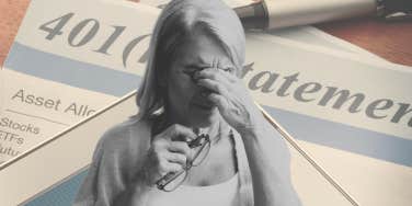 Single mother looking upset in front of retirement papers. 