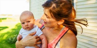 single mom holding baby