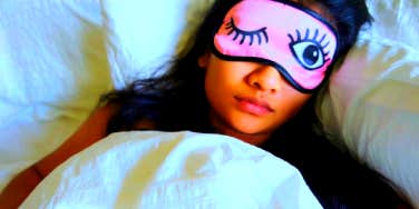 woman sleeping with eye mask on