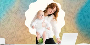 woman holding baby while on the phone and using laptop