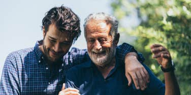 adult and father talking and smiling