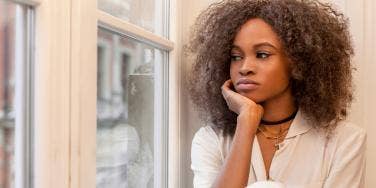 woman looking out the window