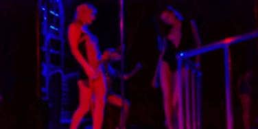 strippers in a dark club