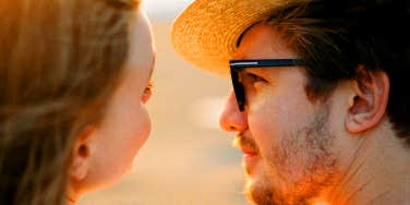 man looking into woman's eyes
