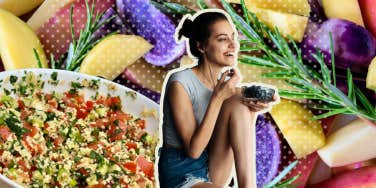 Woman surrounded by superfoods eating blueberries