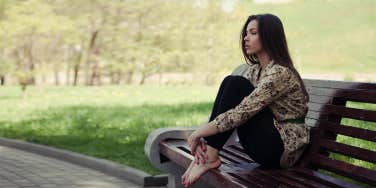 woman sitting on bench