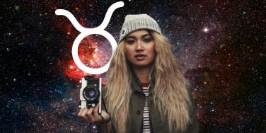 woman with camera and taurus zodiac symbol