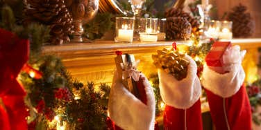stocking hanging on mantle filled with gifts
