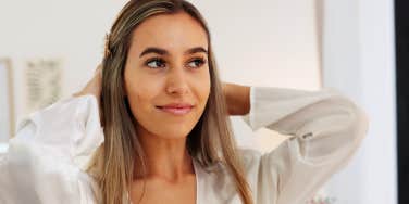 woman looking in mirror