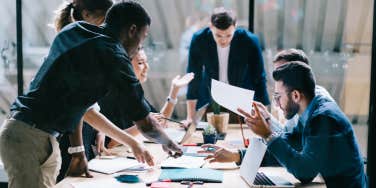 employees brainstorming during a meeting in an office