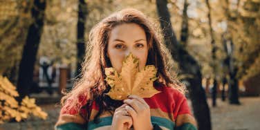 woman holding a leaf