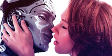 woman kissing robot