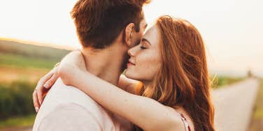 man and woman hugging and embracing 